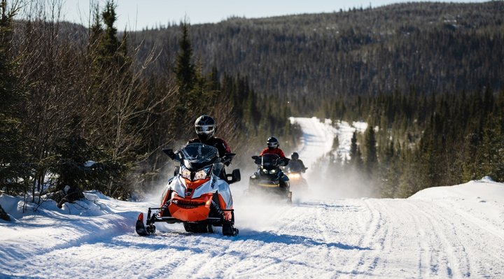 Snowmobile group in winter