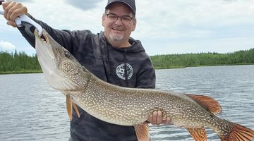 A man presenting his big pike