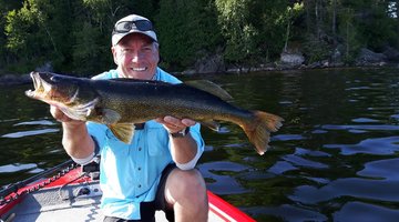 A fisherman presenting his walleye